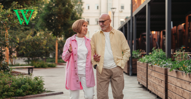 Senior couple walking along path