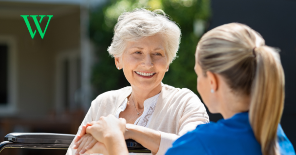 Senior woman with nurse outside